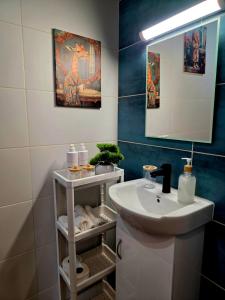 a bathroom with a sink and a mirror at Charshiq Guest House in Veliko Tŭrnovo +22 photos