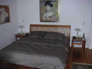 a bedroom with a bed and two nightstands with two lamps at My sweet home Aptm 80 qm in Sauerlach