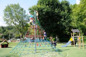 a group of children playing on a playground at ZEcamping 4 animaux acceptés hammam sauna piscine et soirées animées in Espelette