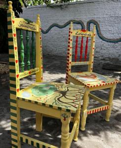 two chairs sitting next to each other next to a table at Z-18 Hostel in Barreirinhas +21 photos