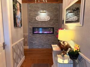a living room with a fireplace with a tv at St Anthonys B&B in Dungarvan