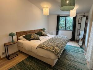 a bedroom with a bed and a window at Domaine Hestia in Robion en Luberon +44 photos