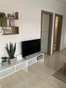 a living room with a flat screen tv on a wall at ArtStay-Apartment in Orestiada