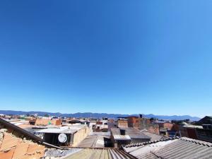 an overhead view of a city with buildings at Bacata Housing full in Bogotá