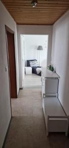 a hallway of a living room with a couch at Bartol in Immendingen +2 photos