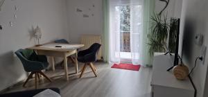 a room with a table and chairs and a window at Bartol in Immendingen