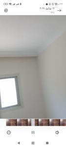a room with a window and a white ceiling at Canarya compound in 6th Of October