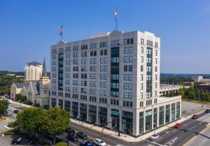 a large white building on a city street at Landing Amazing Studio Gym in Spartanburg