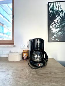a black coffee maker sitting on a counter at Rudnickiego, Fort Bema, free parking by Cosmo Spirit in Warsaw