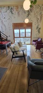 a living room with a couch and a table at Mirador del Torreón in Alcañiz
