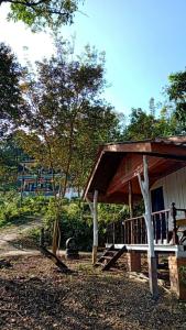 a house with a porch with a roof at Lanta Diamond in Ko Klang