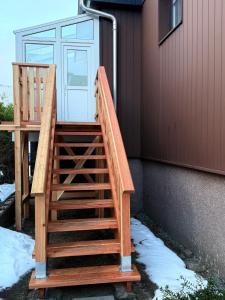 a set of stairs leading up to a house at Apartment 18 in Kurort Oberwiesenthal