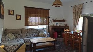 a living room with a couch and a table at Villa Antonia in Chipiona