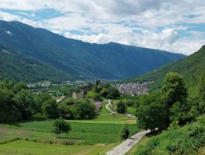 a view of a valley with a town and mountains at Bella Vista casa vacanze in Grosio