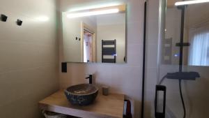 a bathroom with a sink and a mirror at Cal Rocamartí, Turisme Rural - Montant de Tost, Pirineu in Montant +43 photos