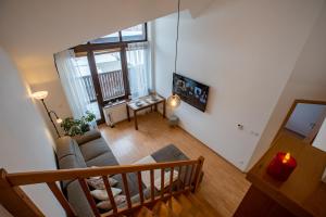 an overhead view of a living room with a couch at Lara Mezonet Tatry in Veľká Lomnica +5 photos