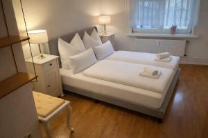 เตียงในห้องที่ Ferienwohnung Flohblick +7 ภาพ