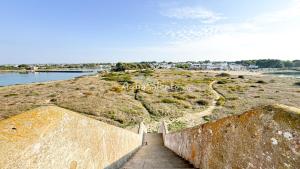 a stairway leading up to a bridge over a river at AQUARAMA Rooms & Apartments in Torre Squillace