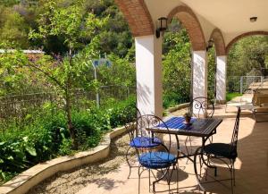 a table and chairs sitting on a patio at Casa Ninin in Alassio