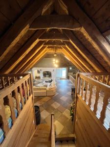 an attic view of a room with a bed at La Grangette de Barbe in Le Béage +66 photos