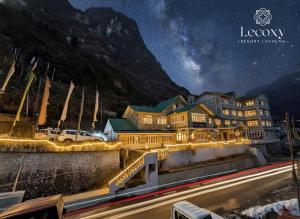 a hotel at night with a starry sky at Lecoxy Resort in Lachung