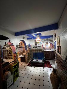 a living room with a couch and a table at Riad abi khancha in Chefchaouen