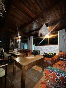 a living room with a couch and a table at Riad abi khancha in Chefchaouen