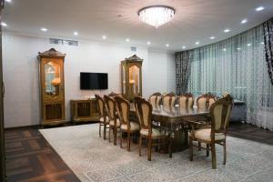 a conference room with a long table and chairs at Hotel Arai Plaza in Taraz