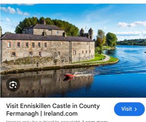 a castle on a river with a boat in the water at The Acres Retreat -Cosy and Welcoming in Lisnaskea +31 photos