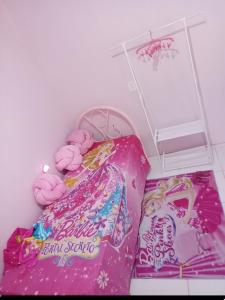 a room with a bed with pink donuts on it at Casa Rosa in Frederico Westphalen