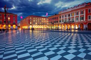 a city square with buildings and a checkered floor at "Le Zen" by EnjoyNice, central spacious apartment with Airco, beach at 10 min in Nice