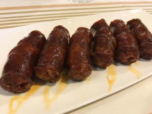 a group of sausages on a plate on a table at Hostal Restaurante Casa Santamaria in Doneztebe +5 photos