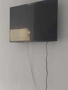 a flat screen tv hanging on a wall at Studio Relax2 in Bacău
