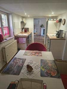 a kitchen with a table with food on it at Ferienwohnung MAI in Glauchau