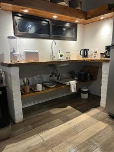 a kitchen with a counter with a sink in it at La Luna in Villa Serrana