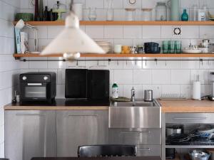 a kitchen with a sink and a microwave at Casa Blanca Łagów in Łagów +7 photos