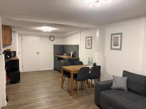 a living room with a table and a couch at Felsenhäuschen in Monschau +37 photos