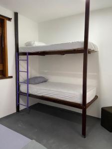 a couple of bunk beds in a room at Pousada Valverde Suíte 2 in Rio de Janeiro