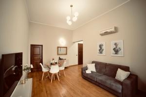 a living room with a couch and a table at Dimora Beatrice in Termini Imerese