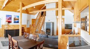 a living room with a couch and a table at Mökki maaseudulla in Raikku