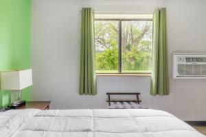 a bedroom with a bed and a window at Studio in Lansing in Lansing