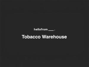 a sign with the words hoglion and toaccoazaazaazaazaaza at hellofrom Tobacco Warehouse in Kavála