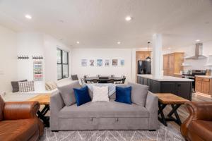 a living room with a couch and a kitchen at Milly 8752 in Brighton
