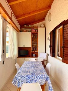 a dining room with a table and chairs at Villa Chiara in Follonica