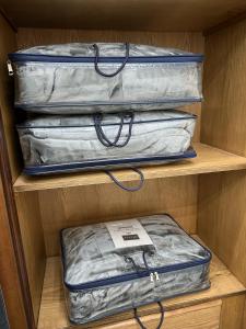 two pieces of luggage are sitting on a shelf at golden apartment - karak - thaniyah الكرك الثنية in Kerak