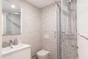 a bathroom with a shower and a toilet and a sink at La Perla - Korčula in Korčula +33 photos