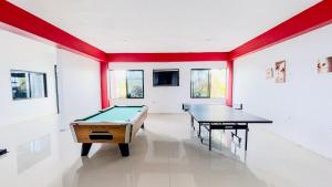 a ping pong room with two ping pong tables at Villa De Shalom in Ocho Rios +95 photos