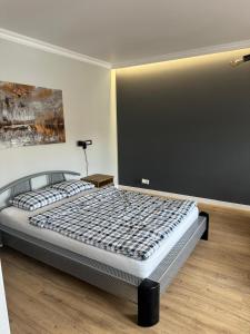 a bedroom with a large bed in a room at Apartament u Laury in Mrągowo