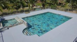an overhead view of a large swimming pool at Tree House River in Palma +24 photos