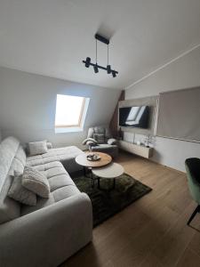 a living room with a couch and a table at Lunara Vlasic in Vlasic